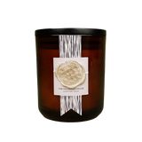 Homepage product shot of The Night’s Tale candle with an ornate label and inky glass jar.