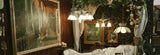 Panoramic image of The Hallowed House setup at Round Top Marburger 2025, showcasing layered textiles, vintage finds, and candle displays.