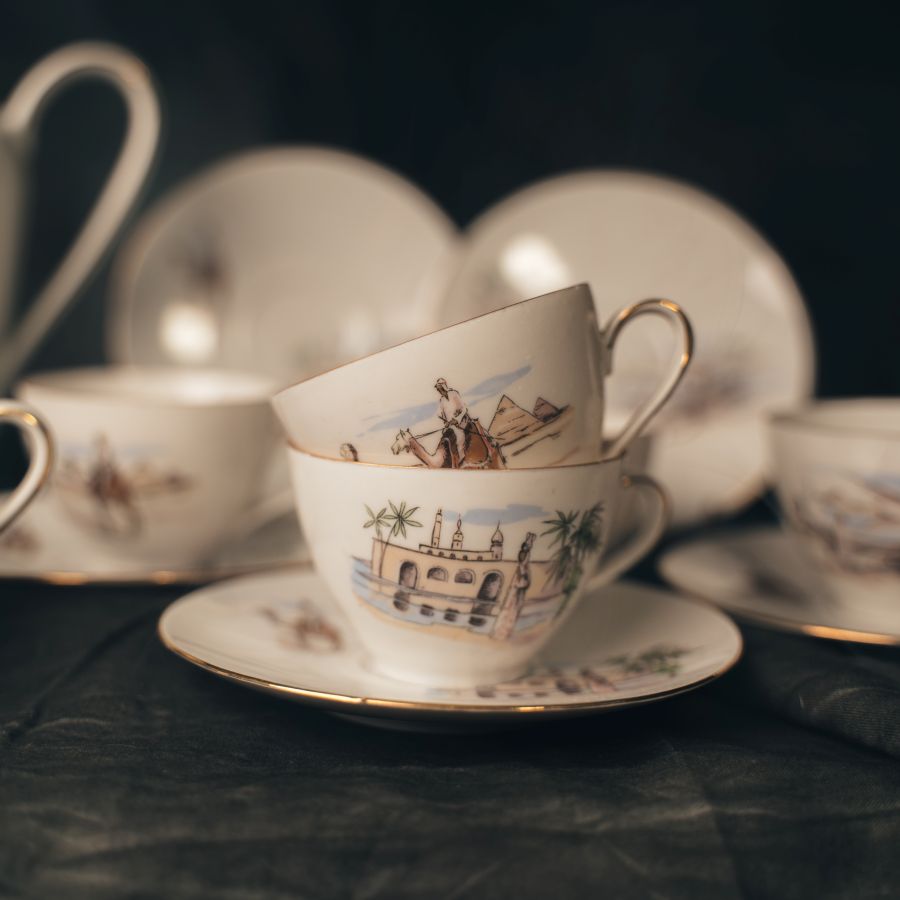 Vintage teacup with scenic design of the desert with a camel and a palace