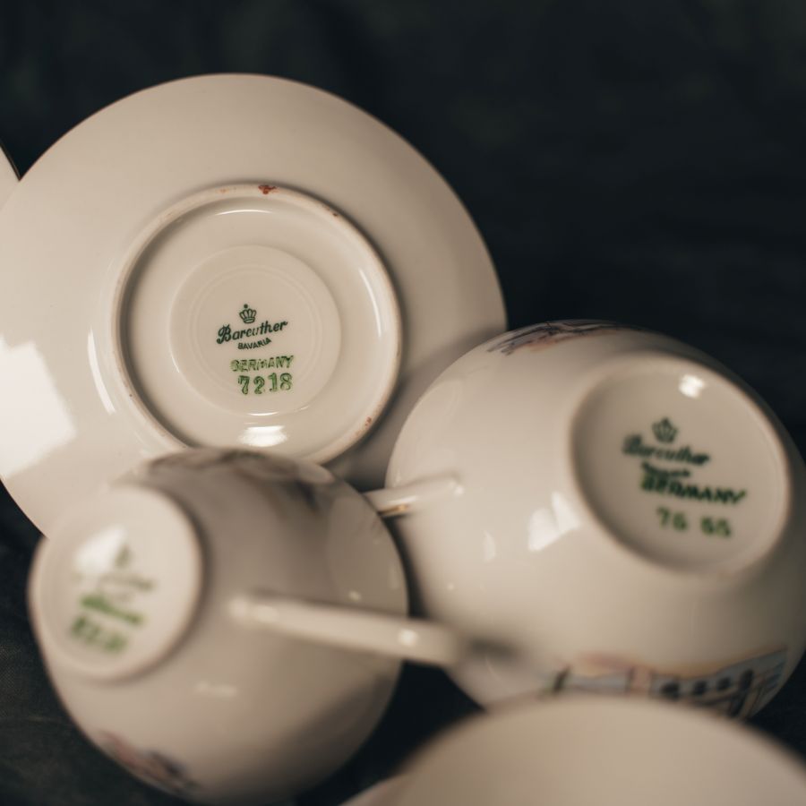 Close-up of teacups with 'Bareuther Steinbach Germany' branding and edition numbers