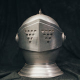Front view of the mid-century knight’s helmet ice bucket in brushed aluminum with a hinged visor lid.