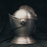 Side view of the knight’s helmet ice bucket showing sculpted contours and metal detailing.