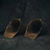 Interior view of stirrups showing aged surface texture and construction details, revealing craftsmanship from a bygone era.