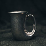 Full view of the 1978 Wilton pewter horn mug with spiral design and curved base, styled against a neutral background.
