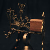 Close-up of the bell’s intricate brass surface, showing gothic motifs and weathered texture that echo the moody atmosphere of The Night’s Tale chapter.