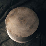 A shot of the bottom of the Guardian Aluminum Four Quart Dome Cooker with "Guardian" stamped on the bottom