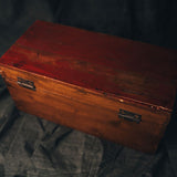 A back view of a Vintage Chinese wooden box with metal clasps 
