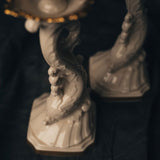 Close up photo of decorative Lenox Aquarius Ivory candle holders with an intricate design 