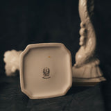 One Ivory candle holder of the set with 'Lenox' logo printed on the bottom