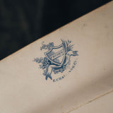 Priory branding with a blue crest and text on the bottom of the Priory E Challinor & Co. serving platter