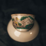 Ceramic cup with scenic design of a castle on a dark background