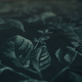 A photo of the Seasons Greetings Velvet Evergreen fabric with a floral pattern