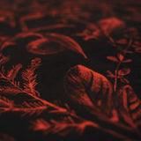 Close-up of textured mulberry Seasons Greetings velvet  fabric with leaf patterns