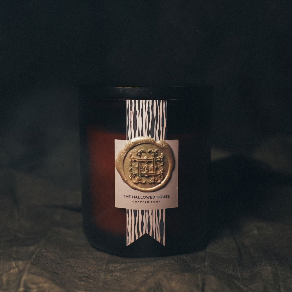The Night's Tale candle with notes of ink and ancient woods for a moody, mysterious glow.